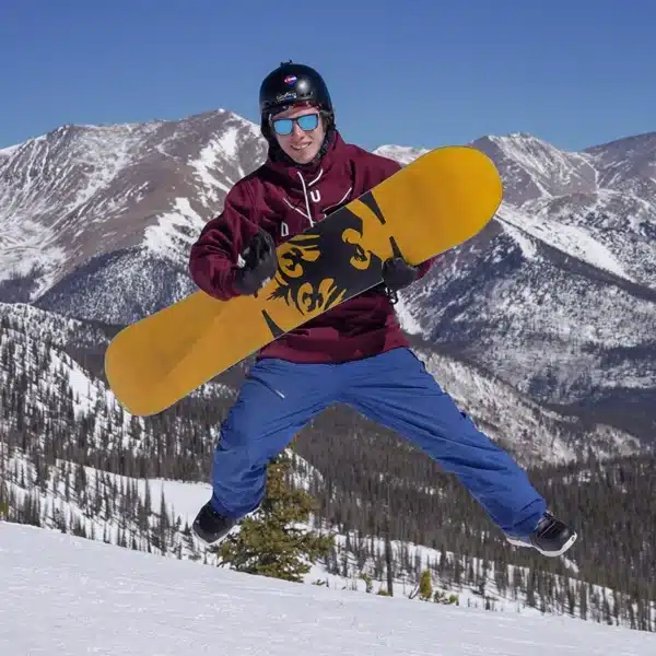 Person Snowboarding on Mountain